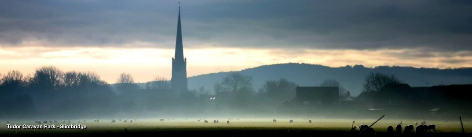 Tudor Caravan Park: Slimbridge Church and mist - by Nicky Warren
